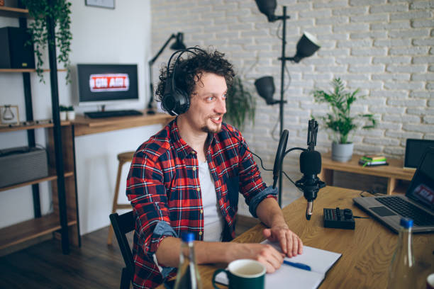 istock Young man recording a podcast 2092174768