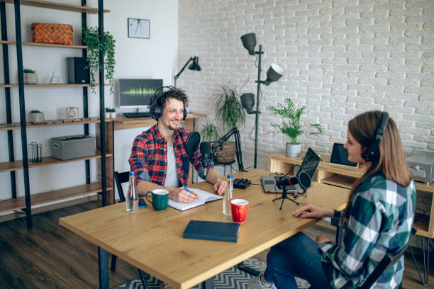 istock Two people recording a podcast in a studio 2092184208