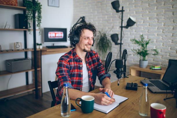 istock Young man recording a podcast 2092185272