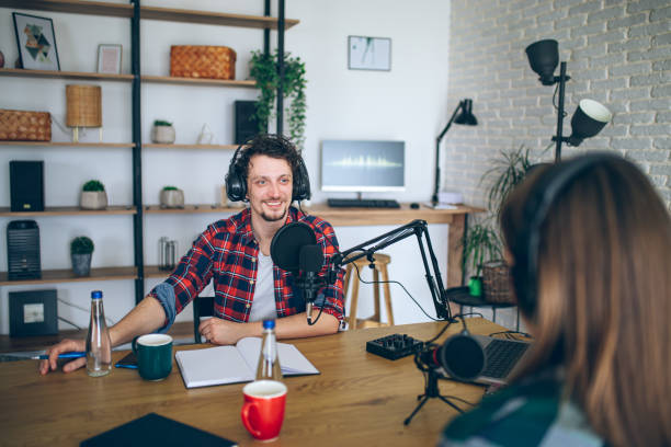 istock Two people recording a podcast in a studio 2092186848
