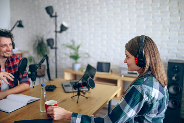 istock Two people recording a podcast in a studio 2092191592