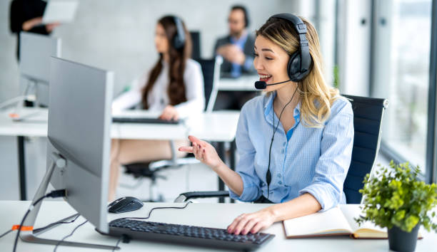 istock Dedicated female helpdesk service agent talking with client at call center. 2092217512