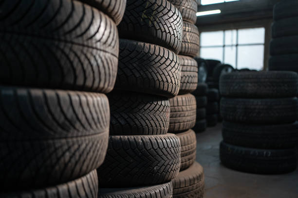 istock stack of car wheel tires at modern warehouse 2092241397