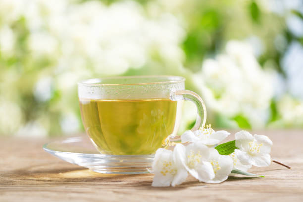 istock cup of jasmine tea and jasmine flowers 2092255272
