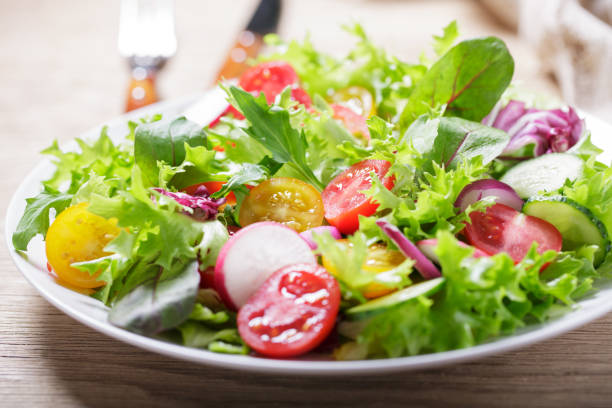 istock plate of green salad with fresh vegetables 2092255802