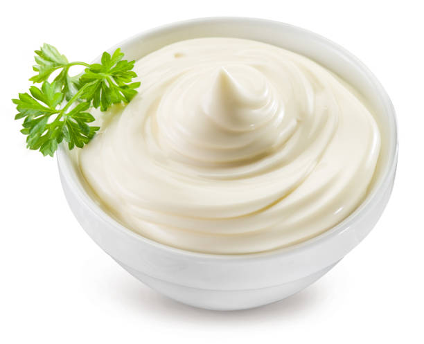 istock Homemade mayonnaise in a white bowl on white background. File contains clipping path. 2092265099
