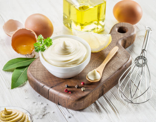 istock Homemade mayonnaise with ingredients and herbs. 2092265611