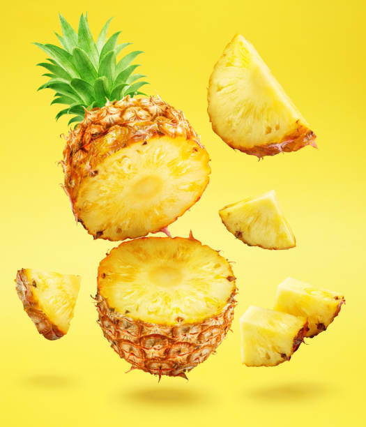 istock Ripe pineapple  and pineapple slices isolated on white background. File contains clipping path. 2092265621