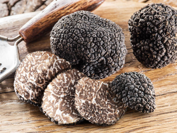 istock Summer truffles and truffle slices isolated on white background. Close-up.. 2092267210