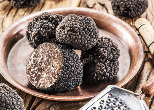 istock Summer truffles and truffle slices isolated on white background. Close-up.. 2092267211