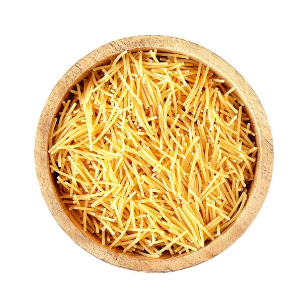 istock Pasta Vermicelli in a wooden bowl isolated on white background 2092276419