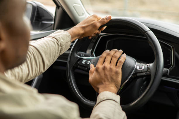 istock Man driving a car with hand on horn button 2092312070