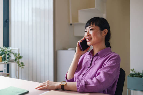 istock Professional Businesswoman Talking on Phone in Office Environment 2092321780