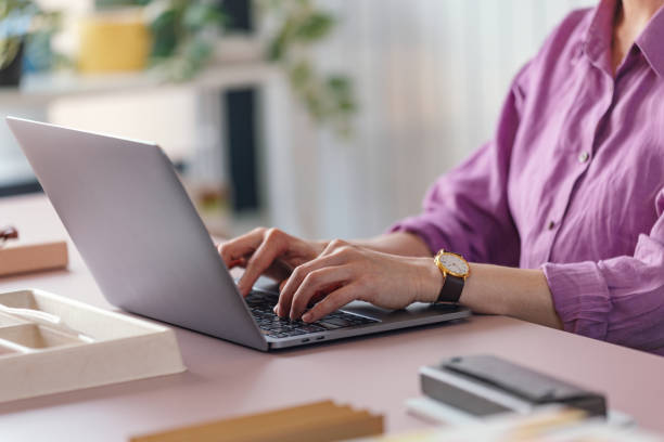 istock Professional Woman Typing on Laptop at Modern Workplace 2092321806