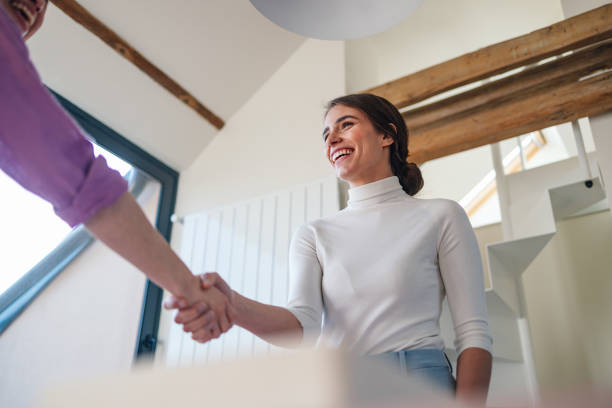 istock Friendly Handshake Between Women Indoors, Positive Interaction 2092321832
