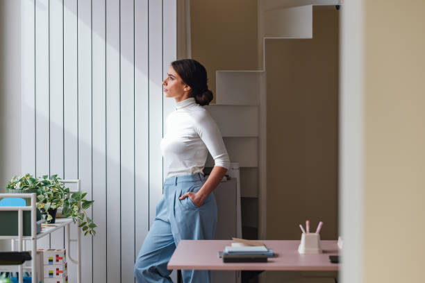 istock Professional Woman in a Modern Office Setting Taking a Break 2092322328