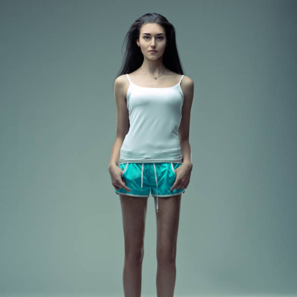 Clad in simplicity, her presence communicates a natural confidence and subtle poise with a natural slim body