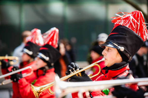 Montreal, Canada - March 18 2024: Marching band with traditional British uniform parading in the Saint Patrick`s Day in Montreal downtown