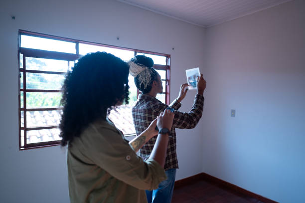 istock Black couple with tablet in new house 2092420649