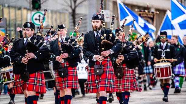 Halifax, Canada - April 15, 2012: A bagpiper with the Royal Canadian Mounted Police plays Amazing Grace at the 100th anniversary Titanic memorial service at Fairview Lawn Cemetery where 121 passengers of the ill-fated ship are laid to rest.