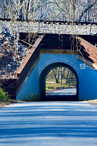 Fairfax Station, Virginia, USA - March 14, 2024: Active railroad tracks pass over the so-called “Bunnyman Bridge” at the Colchester Overpass in Fairfax County.