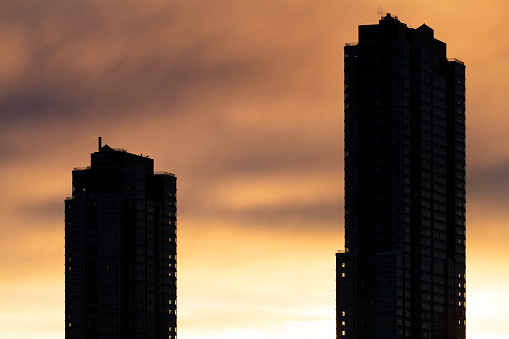 Residential buildings silhouette at sunset