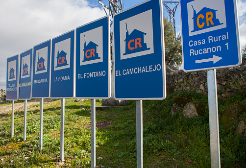 Montanchez, Spain - Jan 12nd, 2024: Rural accomodation sign posts placed at village entrance, Montanchez, Spain