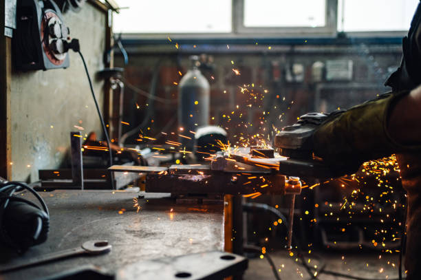 istock Grinding machine grinding the metal plate while the golden sparks fly. 2092499337