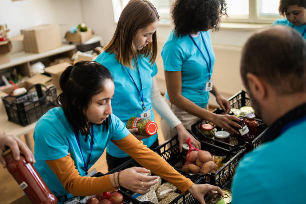 istock Young aid workers organizing emergency food supplies 2092522154