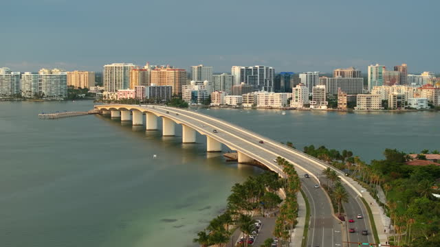 Urban travel destination in the USA. Sarasota city downtown with Ringling Bridge and expensive waterfront high-rise buildings in Florida. Urban travel destination in the USA