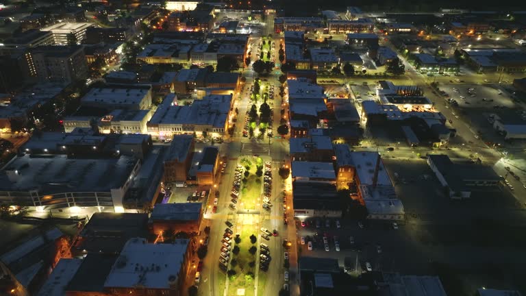 Historical American city architecture at night. Macon, old city in Bibb County, Georgia. Illuminated streets and buildings from above
