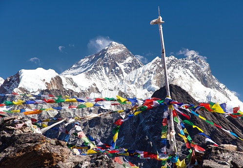 view of Mount Everest and Lhotse with buddhist prayer flags from Gokyo Ri peak, Khumbu valley, Nepal Himalayas mountains