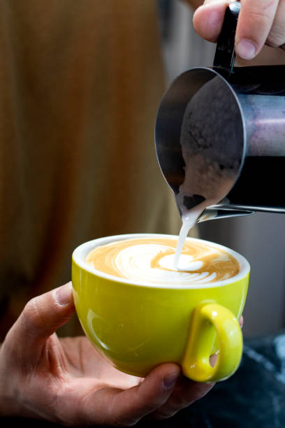istock closeup shot pouring hot milk into cup to make latte art 2092748700