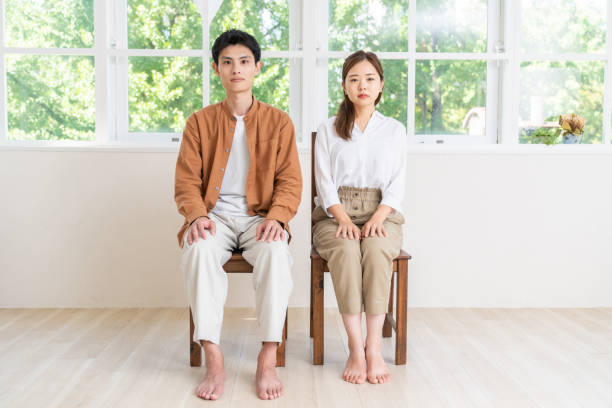 istock asian couple ,  straight face 2092763255
