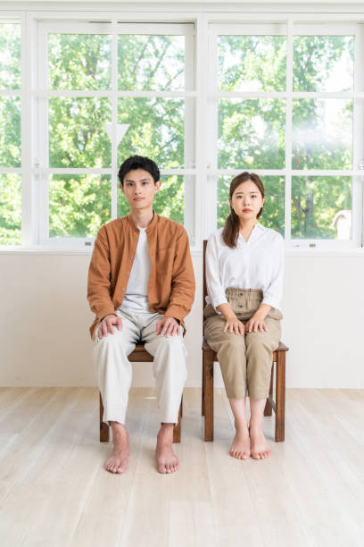 istock asian couple ,  straight face 2092764832