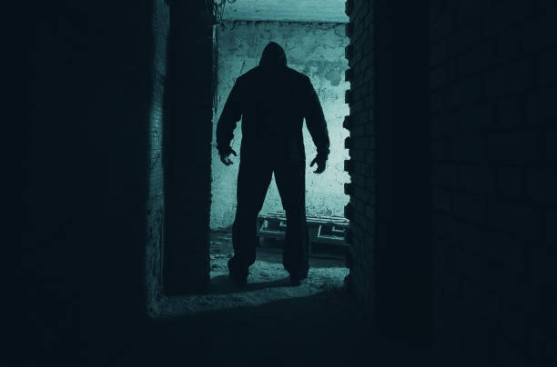 istock A man standing in a doorway in the dark. 2092765886