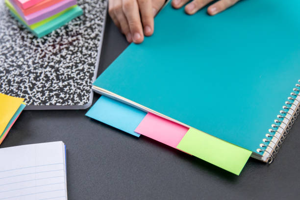 Middle school student uses supplies to do schoolwork
