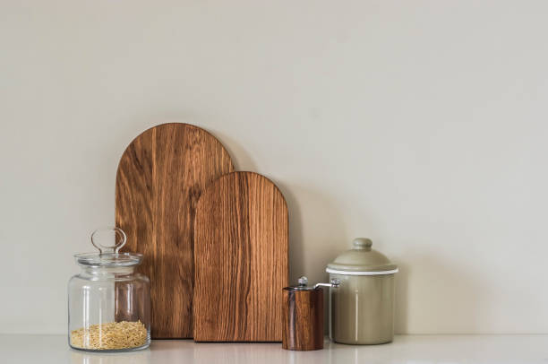 istock Minimalism style kitchen interior - cutting board, spice mill, enameled jar on kitchen countertop 2092920870
