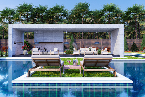 Rear View Of Lounge Chairs On Grass. Lounge Interior With Sofa And Armchairs By The Pool