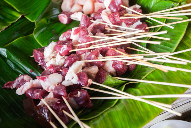 Beef satay before grilling. Sate is a traditional meat dish from Indonesia, beef, chicken or goat skewered in marinade with spices and then grilled.