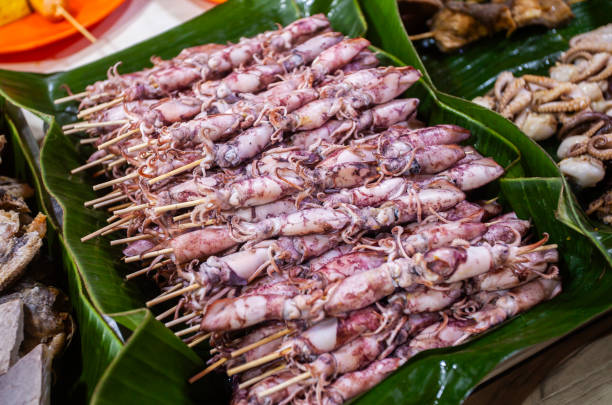 istock squid satay at a restaurant ready to be fried or grilled before serving. 2092973072