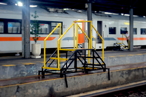 Portable steps with handrails for train passenger in Indonesia.