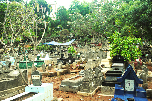 Semarang city, Central Java, Indonesia, 03-10-2024:\nBergota public burial place in Semarang, Indonesia is a free access and it doesn't a ticket to enter the cemetery area.