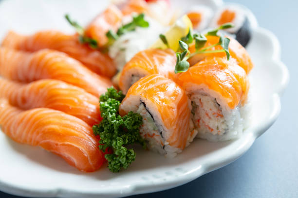 istock Salmon Sushi and California Rolls 2093037500