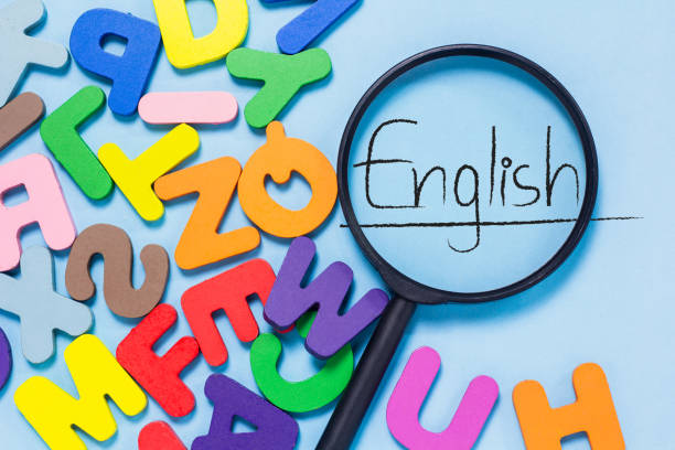 istock English letters scattered on blue background. 2093074132