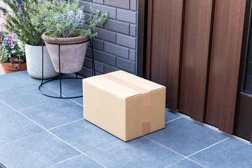 A cardboard box placed at the entrance.