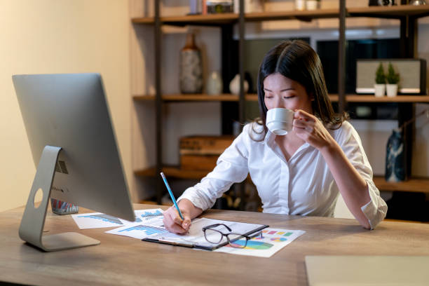 istock The young woman is drinking coffee for work until late 2093105390