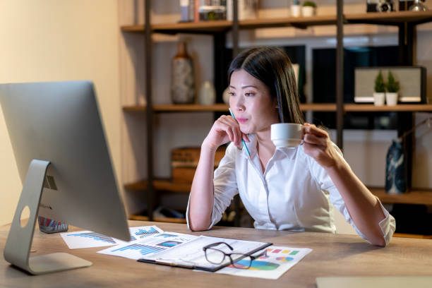 istock The young woman is drinking coffee for work until late 2093105393
