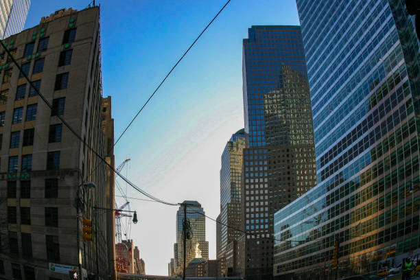 New York , USA - November 18, 2009: Manhattan skyscrapers, bottom-up view on blue sky background, USA