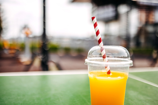 Orange juice in plastic take away packaging